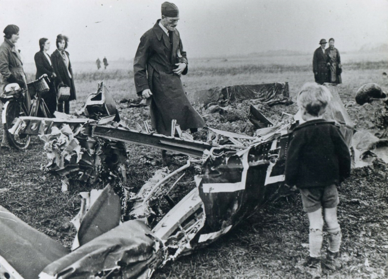 4 Young boy close up to wreckage